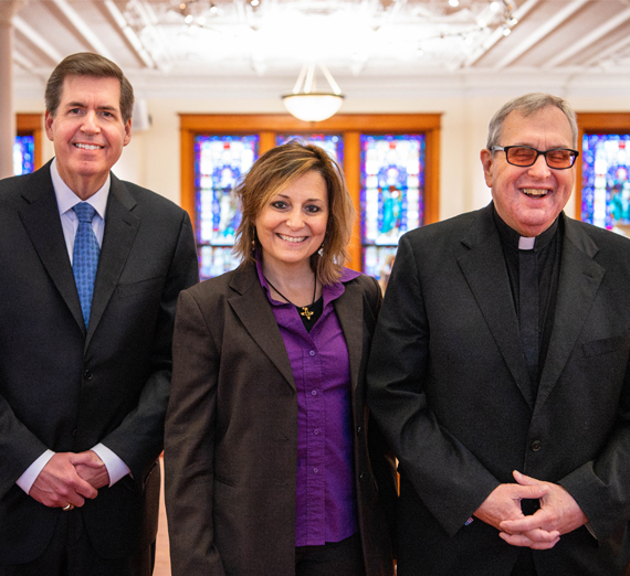 Women's rowing team members packing bags at Second Harvest warehouse
